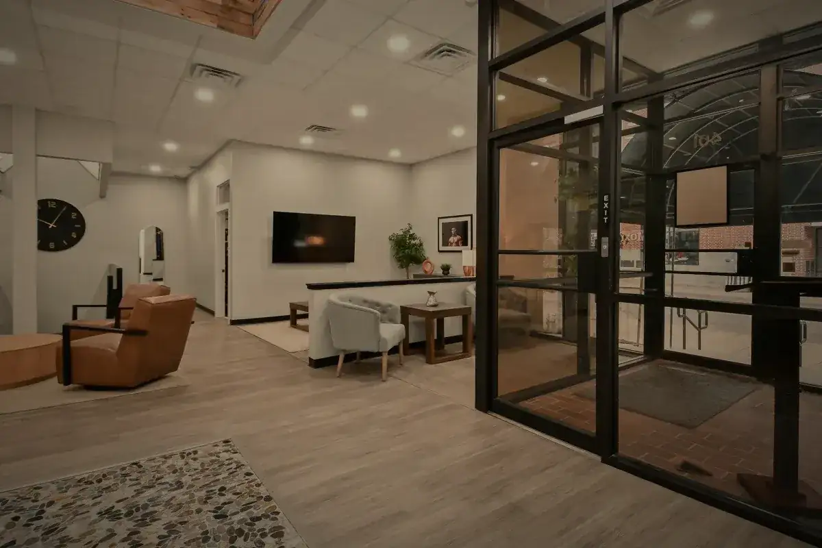 The glazed inner doors onto the main floor, seating beyond.
